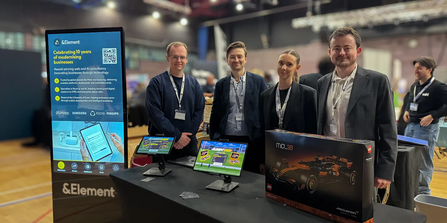 The &Element team at its exhibition booth with interactive displays and the McLaren LEGO prize