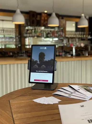 Win a Glamping Getaway tablet kiosk at the bar