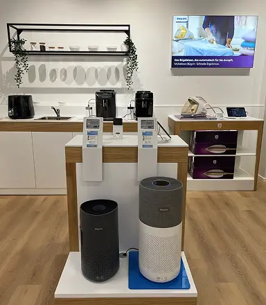 Home appliances showroom with an air purifier and coffee machine