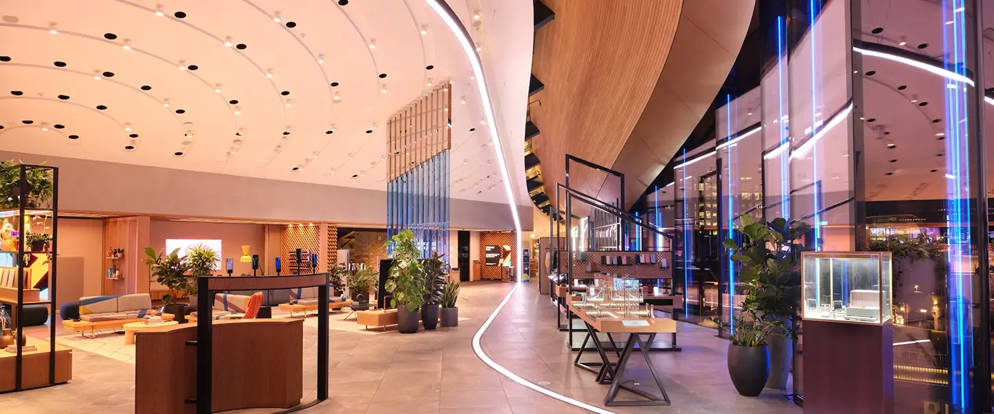 Samsung KX luxury showroom with curved ceiling and blue LED pillars